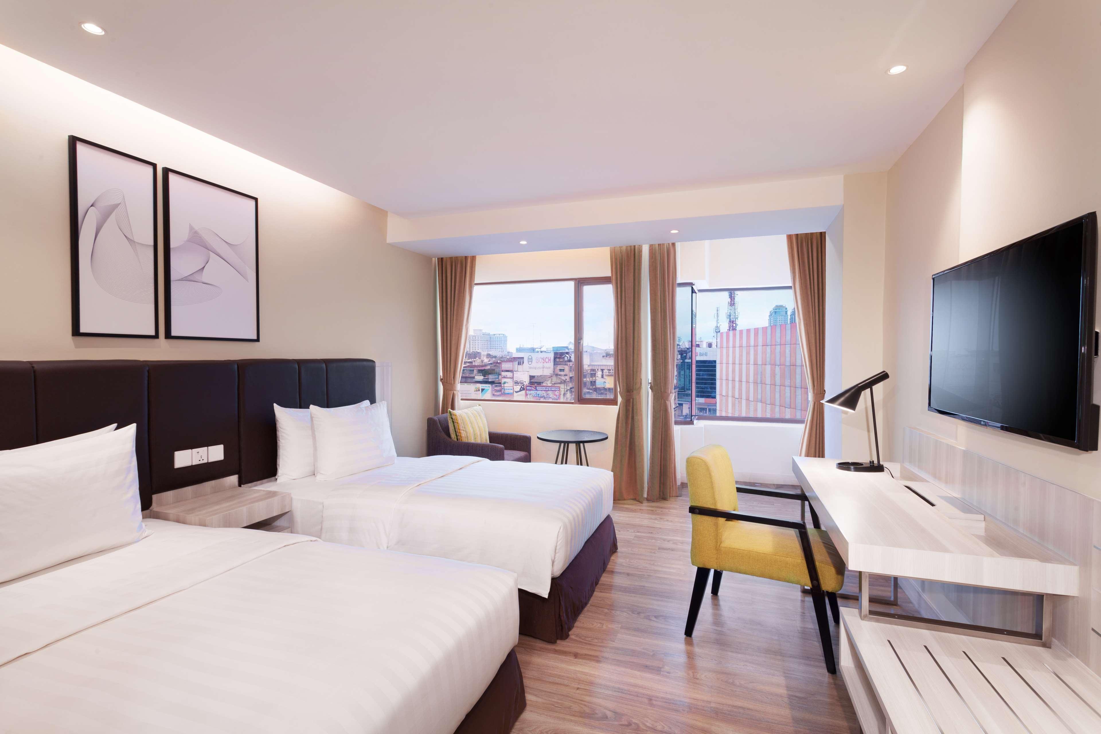 Aiho Hotel Medan Zimmer foto